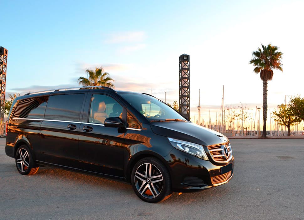 One of our mercedes V class vans of the private transportation services Barcelona, waiting to offer a trip with the maximum comfort and luxury in a sunset.